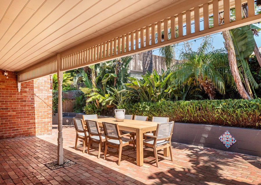 Outdoor courtyard with dining and festive lighting