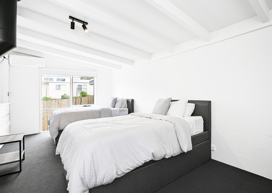 Bedroom four with 2 king single beds and two trundle beds 