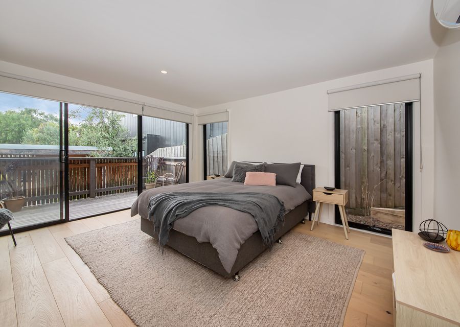 Bedroom with queen bed, air con and balcony access
