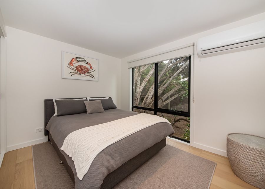 Bedroom three with queen bed and air con 