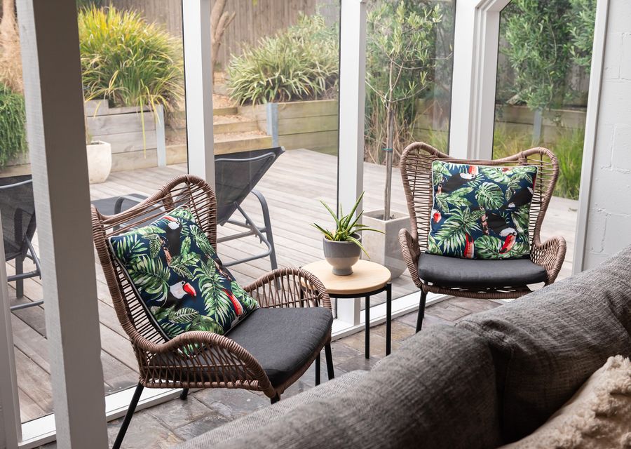 Enjoy each armchair that boasts a sturdy wooden frame, meticulously crafted to ensure durability and stability. 