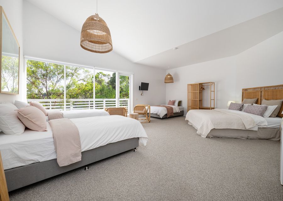 Bedroom six with king bed, two single beds and one king single bed, sleeping 5