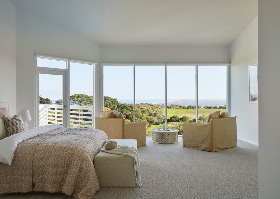Bedroom four with king bed and small balcony 