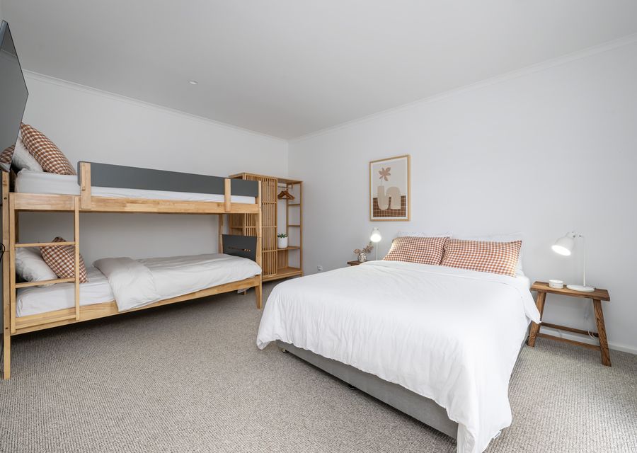 Bedroom eleven with queen bed and king single bunk, sleeping 4