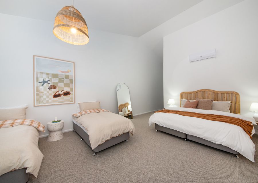 Bedroom one with king bed and two single beds 