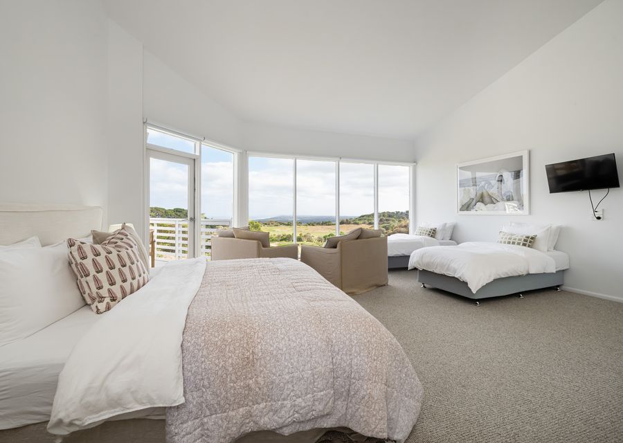 Bedroom four with king bed and two single beds - sleeping four 