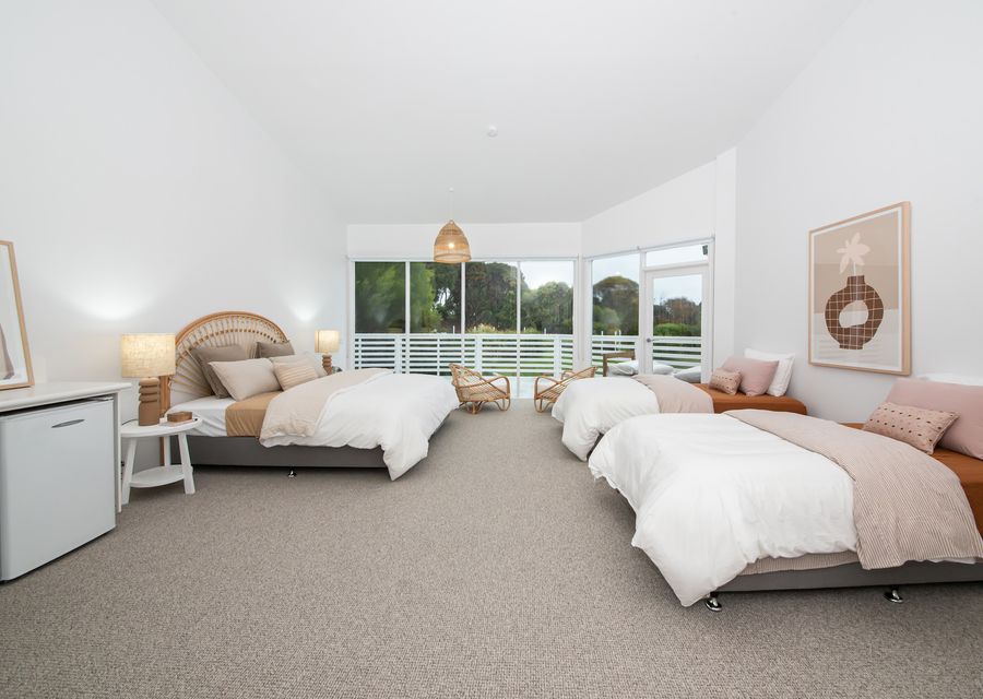 Bedroom two with king bed and two king single beds 
