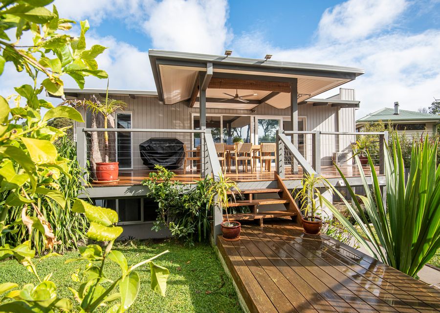 Balcony at the back of the house that leads to the back yard and pool area.  out door dining for eight and bbq 
