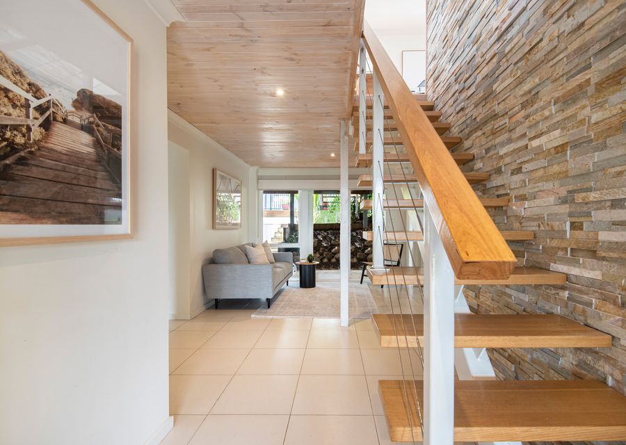 Downstairs living and stairs leading to main living 
