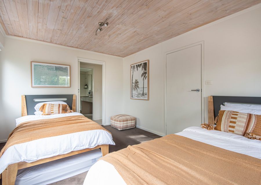 Downstairs bedroom with two king single beds and two single floor mattresses if required 