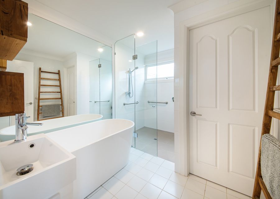 Main floor bathroom with separate toilet.
