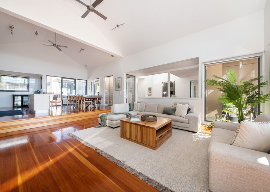 Step into our inviting living room, featuring a plush sofa adorned with soft throw pillows.