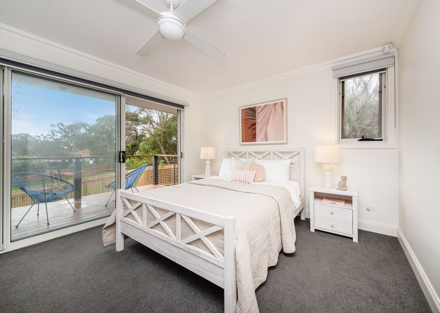 Master with balcony access, ensuite and queen bed, dedicated desk space and TV 