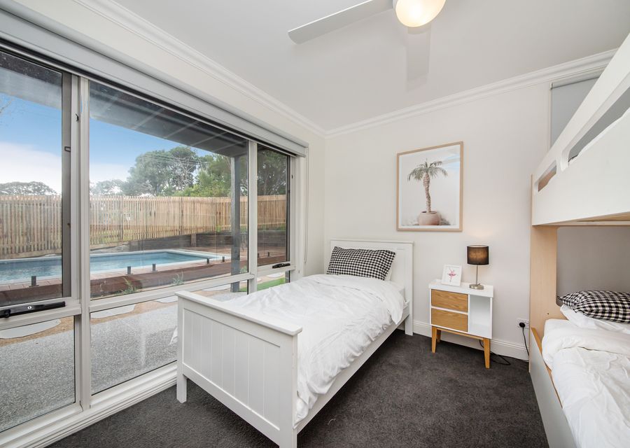 Downstairs bedroom with single bunk and single bed, sleeping 3