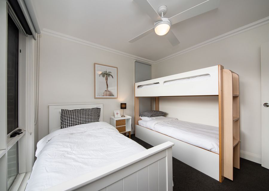 Downstairs bedroom with single bunk and single bed, sleeping 3