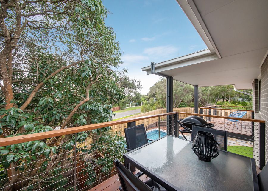 Upstairs balcony overlooking the pool and yard