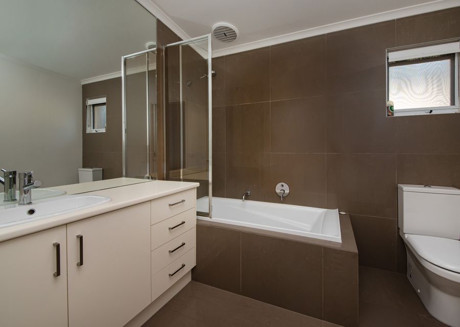 Main bathroom downstairs with bath, shower and toilet 