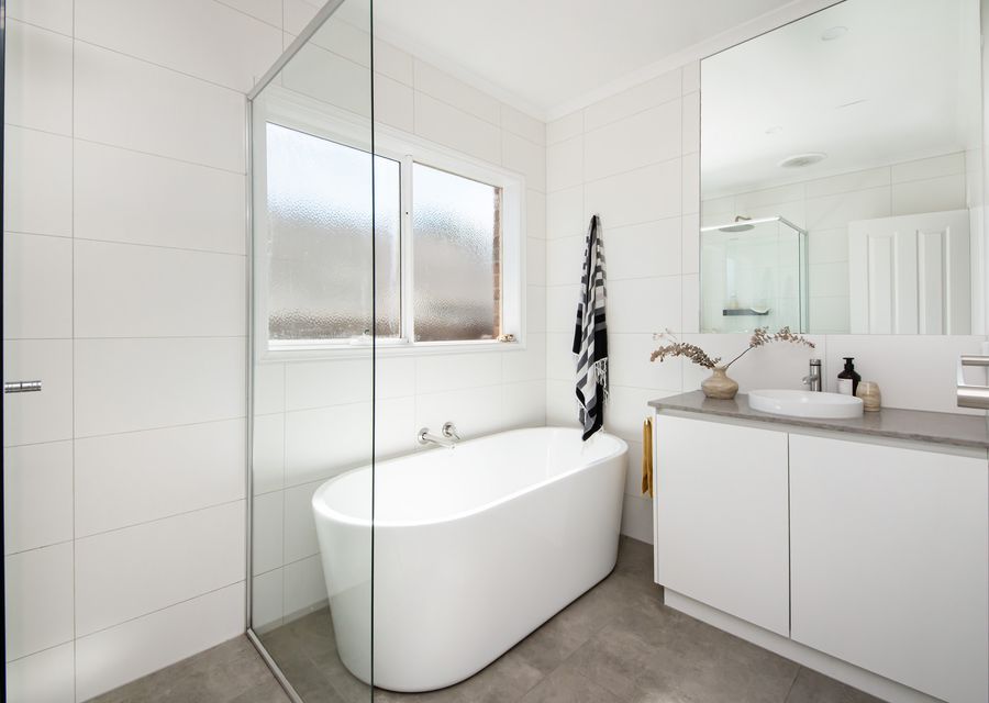 Bathroom with bath and shower