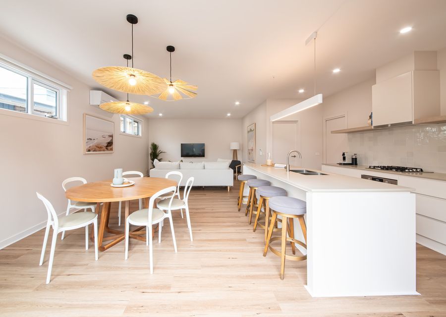 Step into our inviting dining area and kitchen, where culinary delights and shared meals come together in a space designed for both comfort and functionality