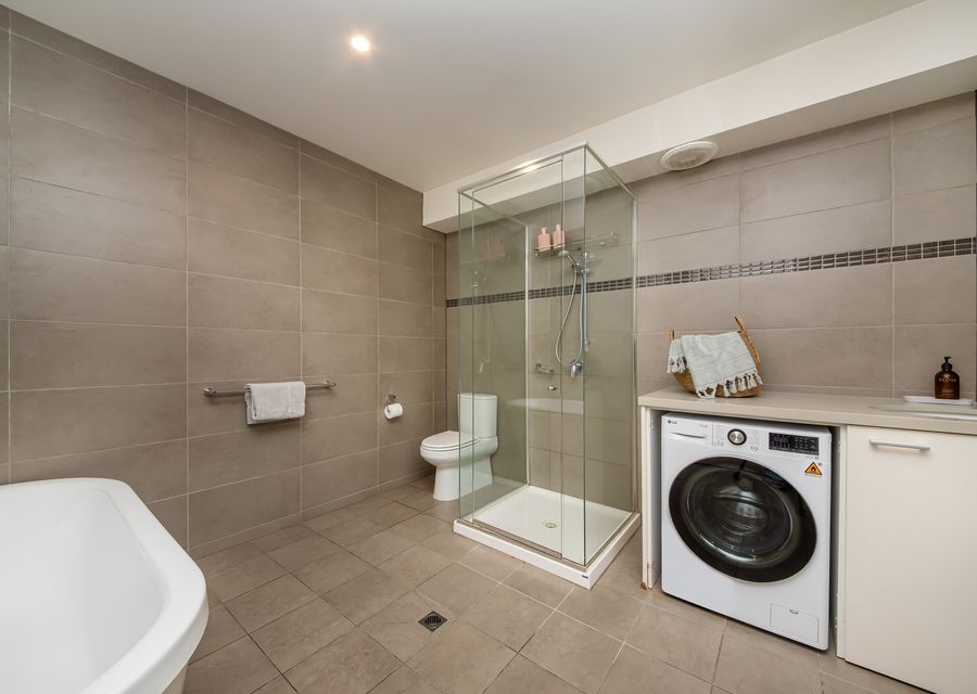 Full bathroom including bath and shower 