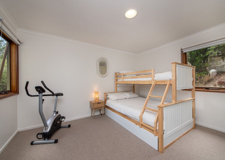 Bedroom two with double bunk and single above 