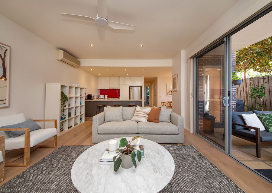 Light and bright living spaces leading to courtyard 
