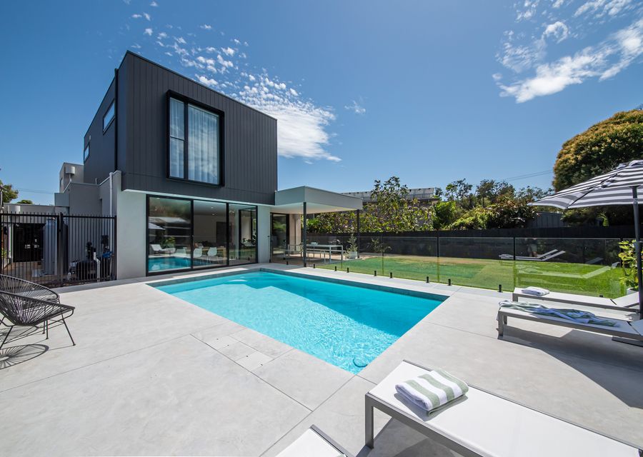 Property facade with solar-heated saltwater pool