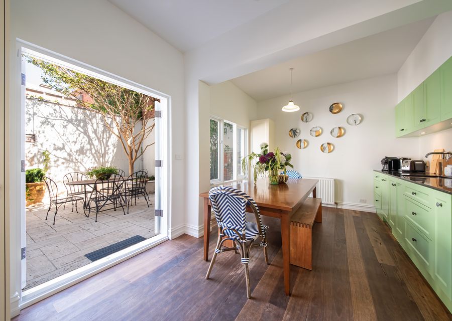 Kitchen/Dining flowing into private courtyard