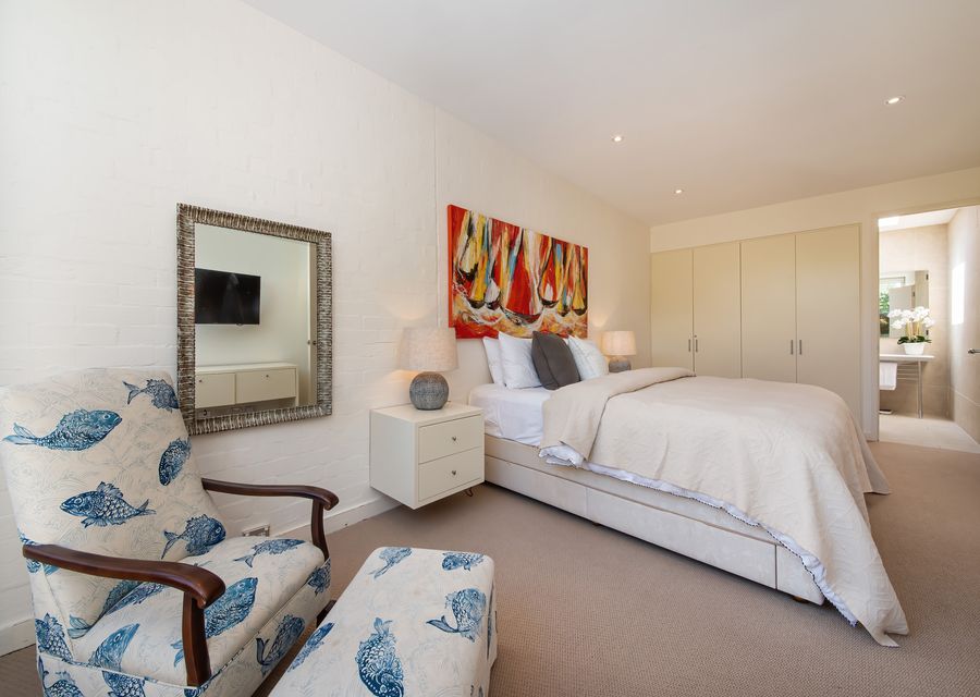 Sophisticated Masters bedroom with King size bed and attached Toilet and Shower 