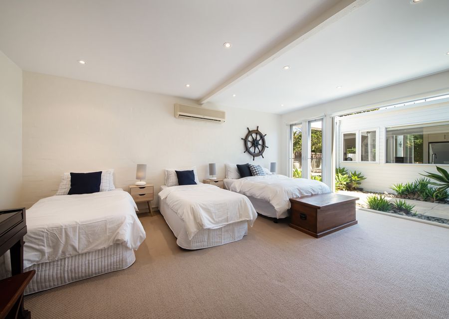4th Bedroom with two single beds and a double bed 