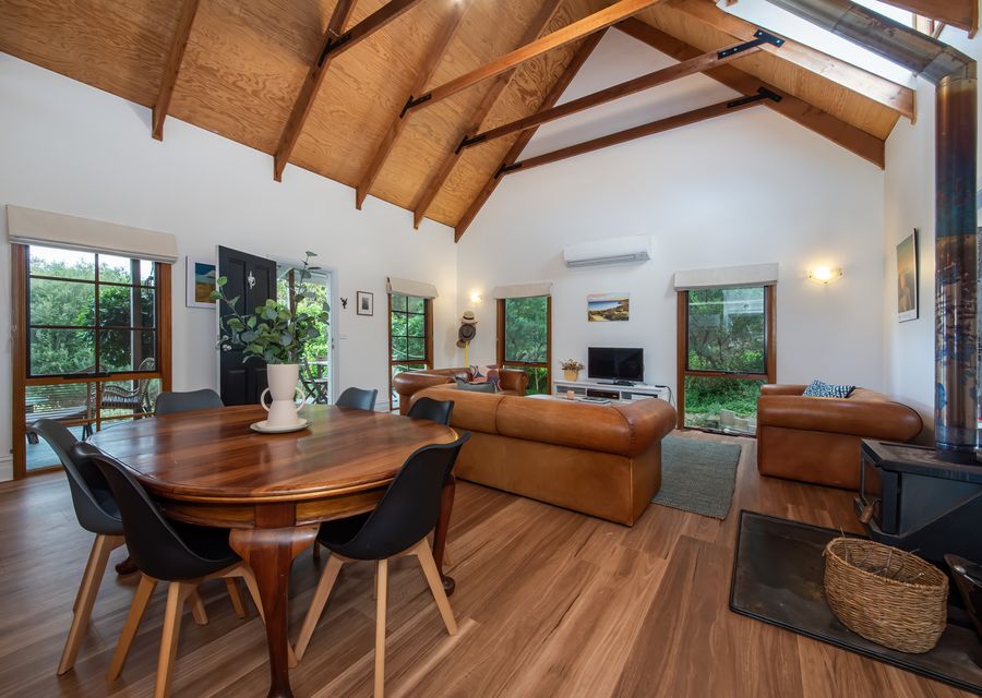 Open plan living and dining with cosy fireplace