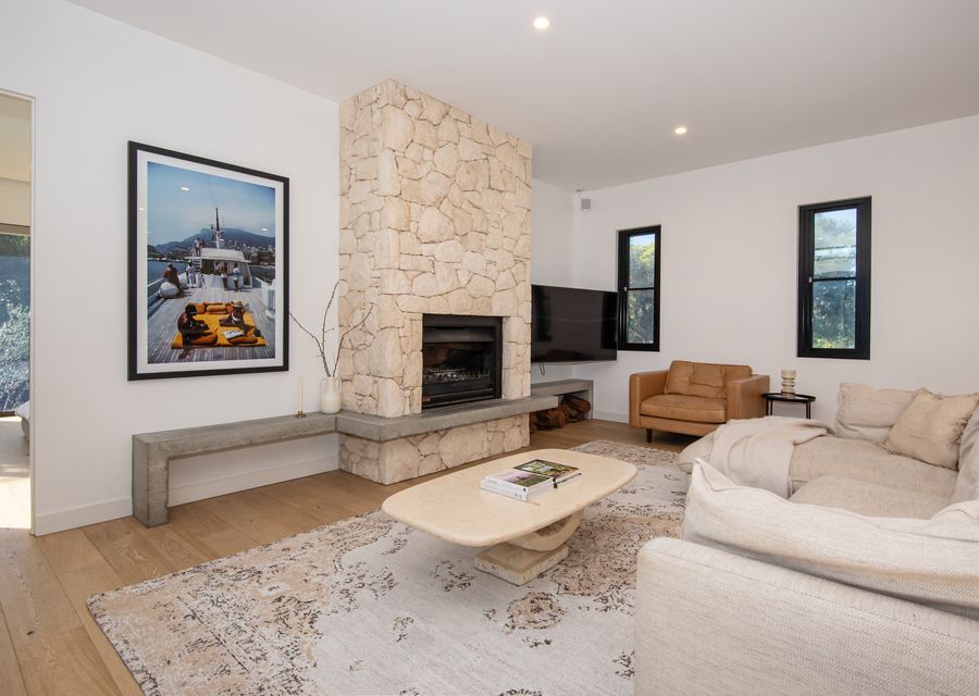 Open plan TV area with fireplace 