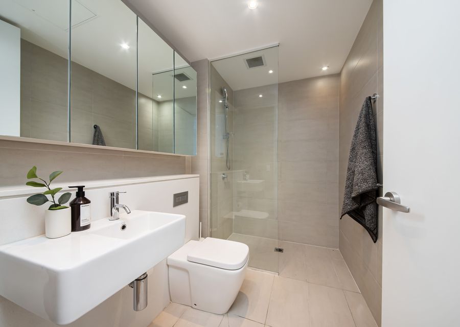 Modern bathroom with large vanity and walk in shower