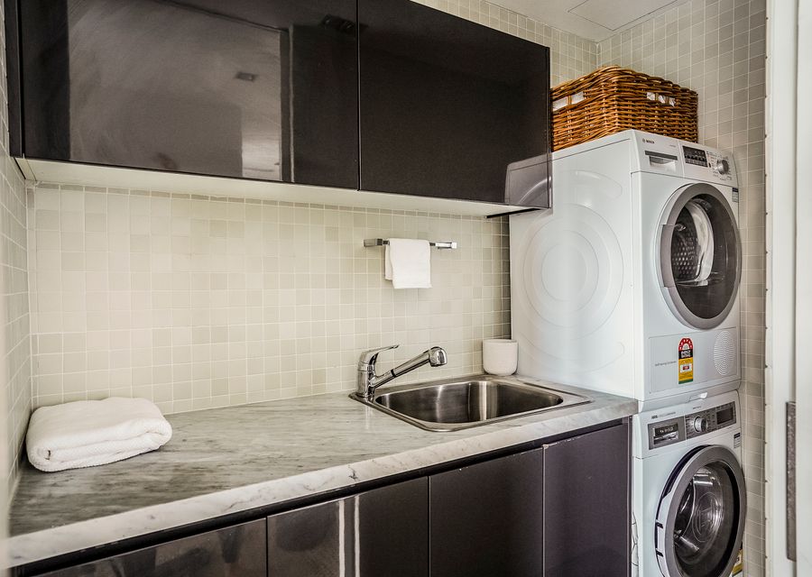 Laundry with front load washer and dryer for your use