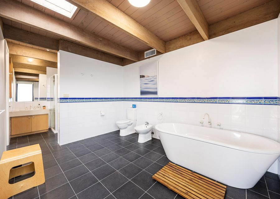 Full bathroom with a tub