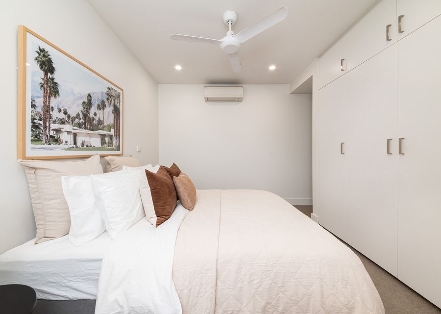 Master bedroom with queen bed, air con and plenty of storage 