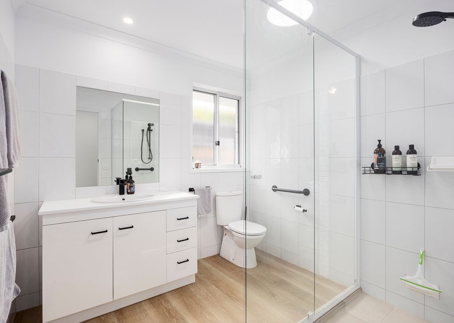 Bathroom with shower starter supplies of shampoo, bodywash & conditioner 