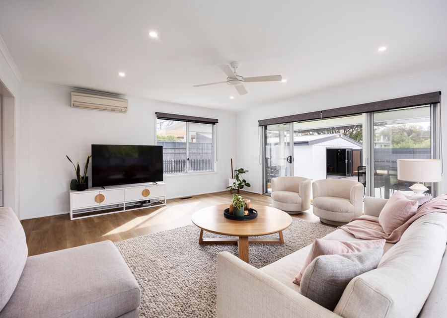Living room with smart TV and split type AC 