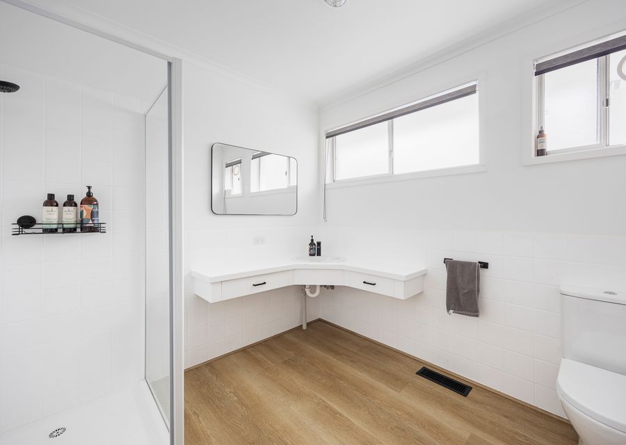Full bathroom with shower and toilet 