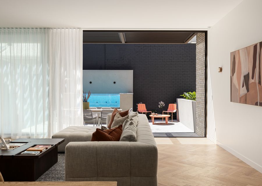 Living leading out to courtyard with gas heated plunge pool 