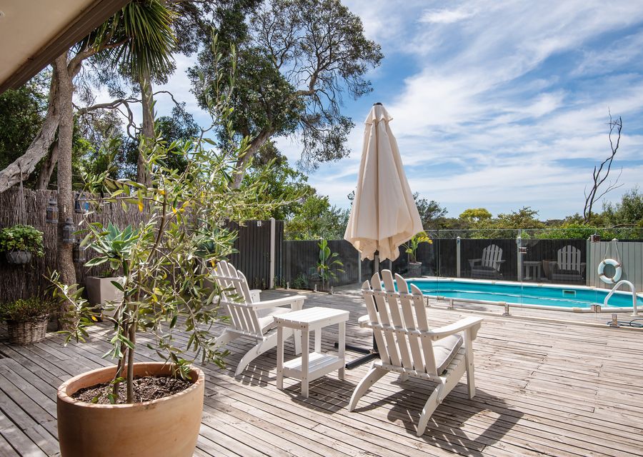 Sun deck next to alfresco dining with TV