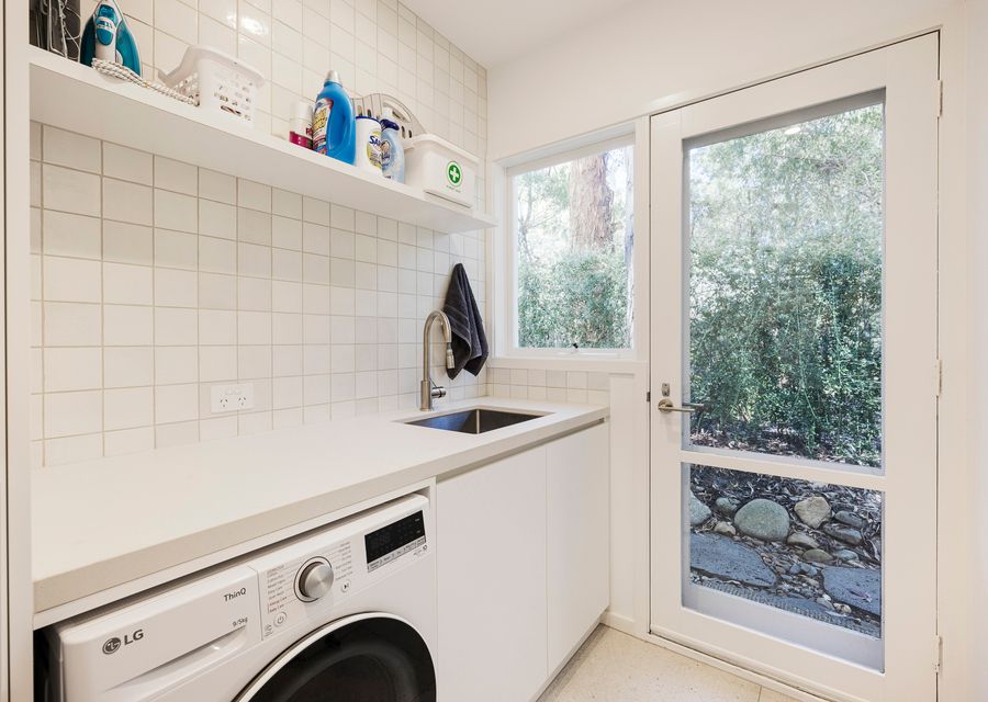 Laundry area with combination washer and dryer 