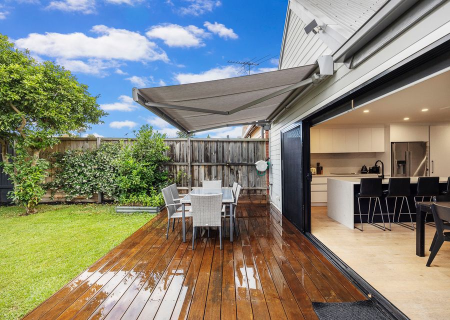 secure rear yard with outdoor dining