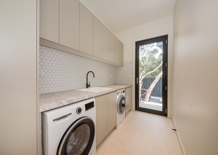 Laundry area with both washer and dryer 