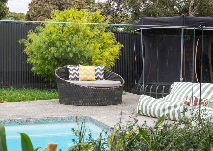 Sun loungers and seating area beside the pool 