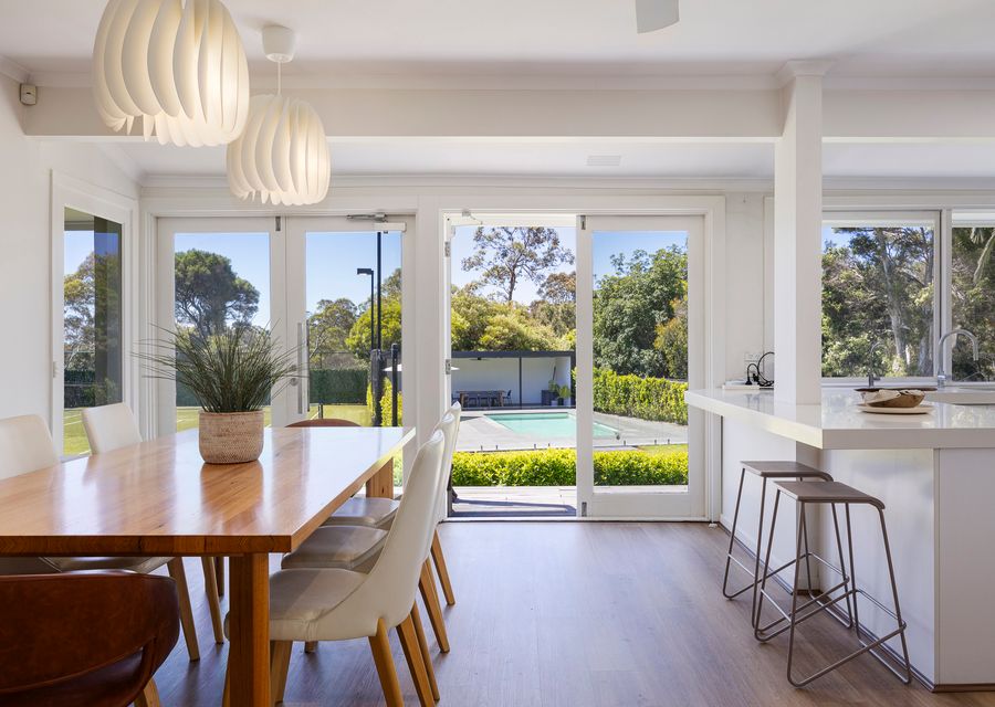 Kitchen and dining looking over the pool and tennis court 