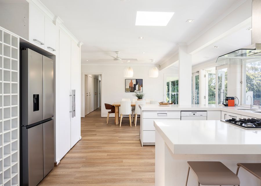 Kitchen with basic appliances and a fridge 