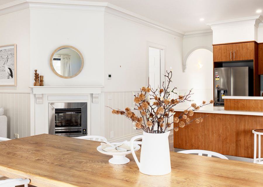 Fireplace near kitchen, dining, and living area 