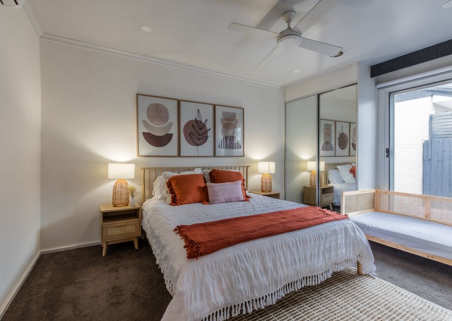 Master bedroom with queen bed and single  day bed
