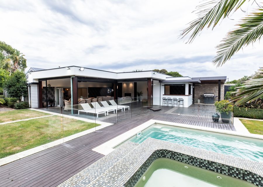 Spa and pool with outdoor seating 
